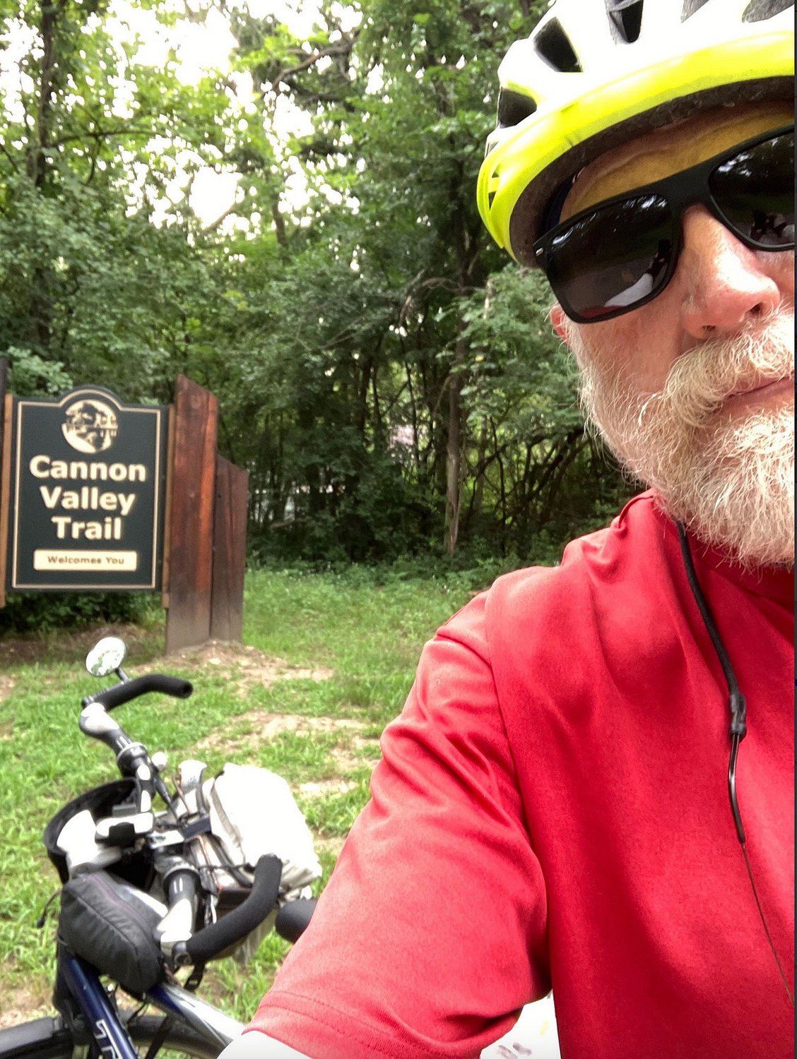 Fort Madison's Bruce Huddleson poses outside one of the nature areas along the Cycle America trek.