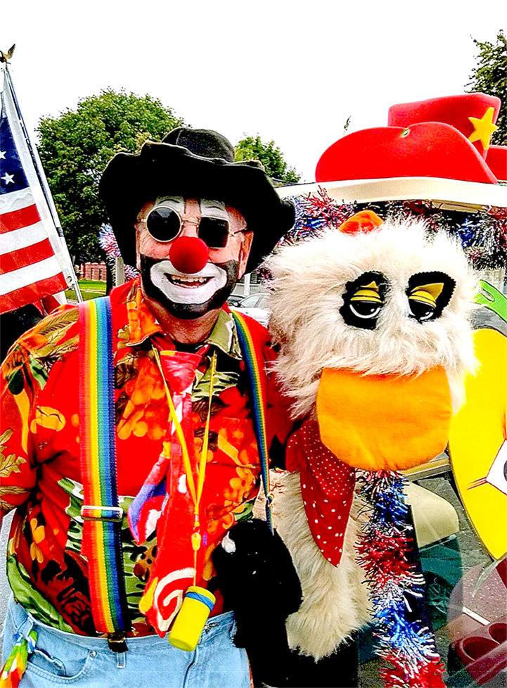 "Shoeloose" the clown poses with friend "The Gooney Bird" that he rides into the Grand Entry with at the Tri-State Rodeo