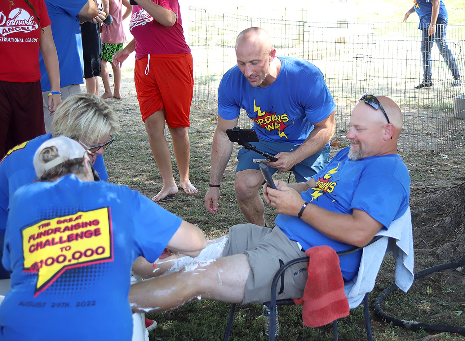 Fort Madison City Councilwoman Donna Amandus and PAW Animal Shelter Director Sandy Brown shave the legs of Cliff Dawley, Monday afternoon at the Jordan's Way fundraiser.