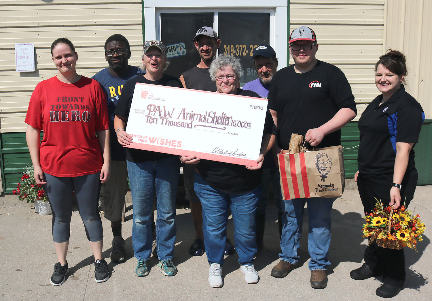 KFC officials presented PAW Director Sandy Brown and staff with a check Saturday for $10,000