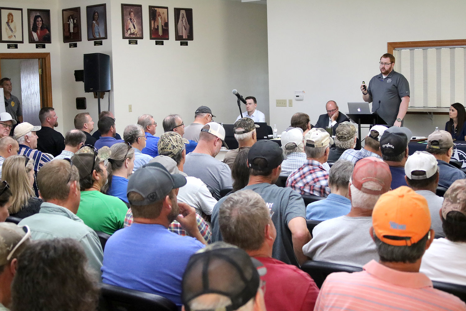 Representatives with the Iowa Utilities Board talk with a packed house at the Lee County Fairgrounds Youth Center Thursday afternoon about the proposed Heartland-Greenway carbon sequestration pipeline.