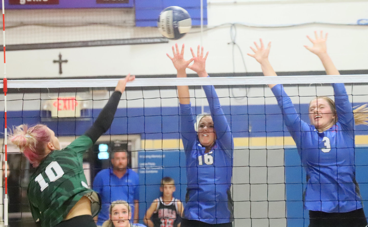 West Burlington's McKenna Marlow (10) goes for a kill against the Holy Trinity front defense in Thursday's five set thriller at Shottenkirk Gymnasium in Fort Madison.