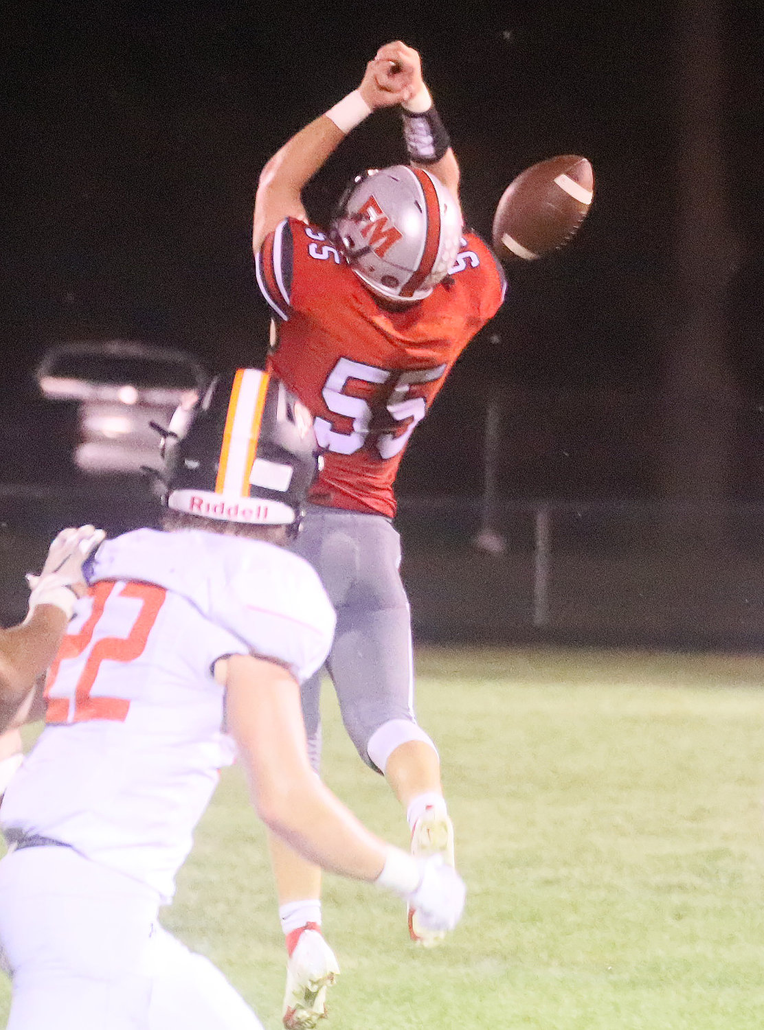 Tanner Settles (55) just misses picking off an Ethan Patterson pass in the first half Friday night. In the second half Settles would knock down a pass that was intercepted by the Hounds.
