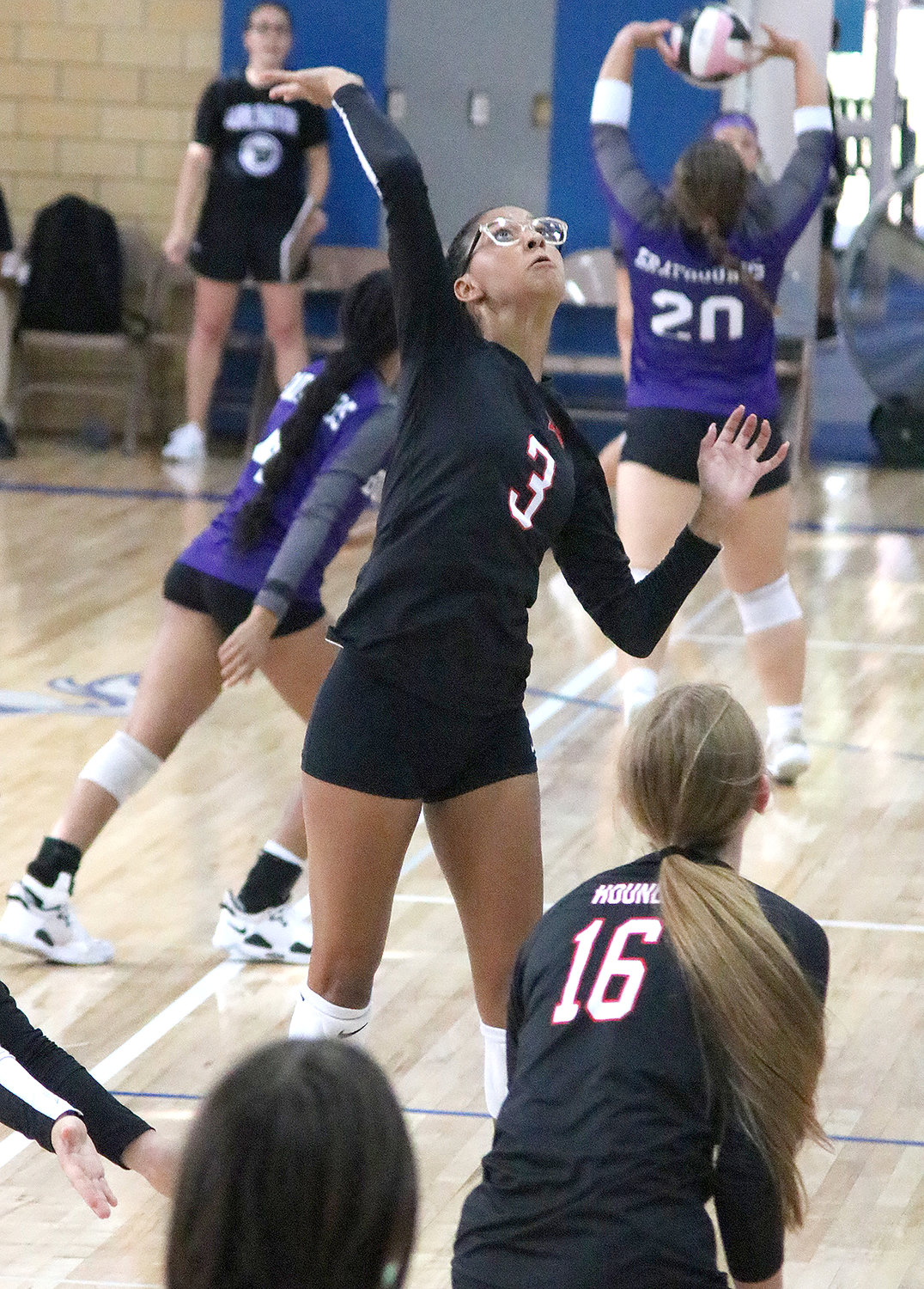 Fort Madison's Aija Jenkins goes for the attack for the Lady Hounds Tuesday night at the Holy Trinity Catholic Invitational. The Hounds went 0-3 on the night. HTC won the tournament without dropping a set