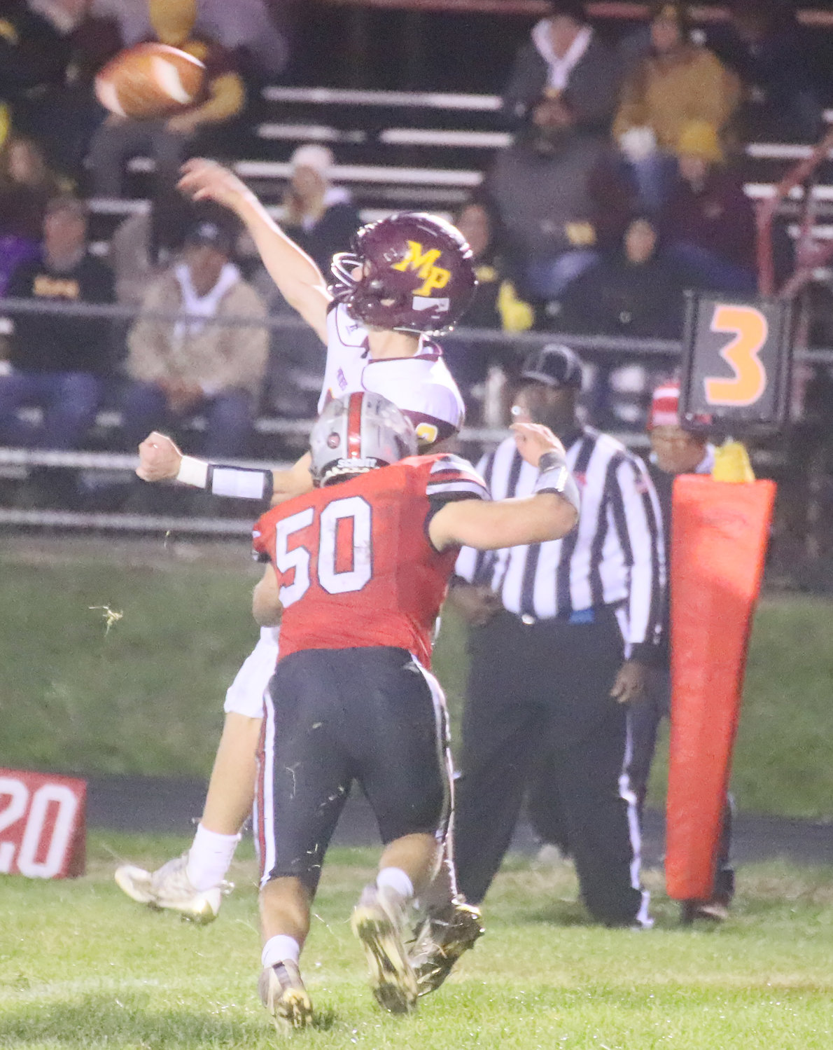 Ike Thacher, art of the Hounds defensive T-N-T threat on the defensive line, gets pressure on Richtman in the second half Friday night