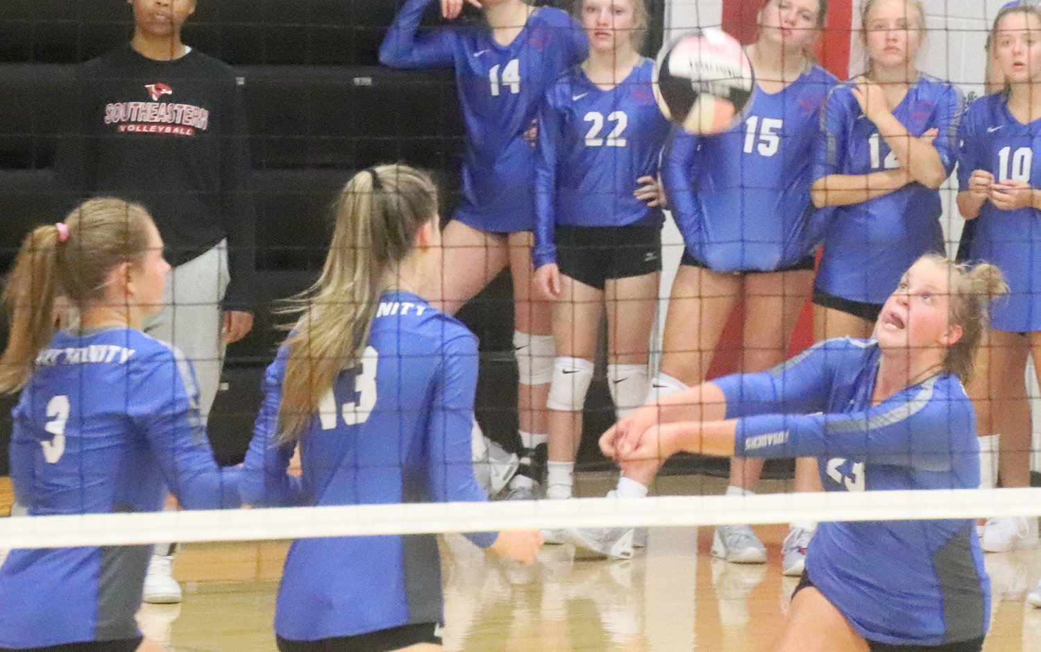 Holy Trinity's Brooke Mueller keeps a ball in play in game 2 against WACO Saturday night at the Southeast Iowa Superconference volleyball finals at SCC.