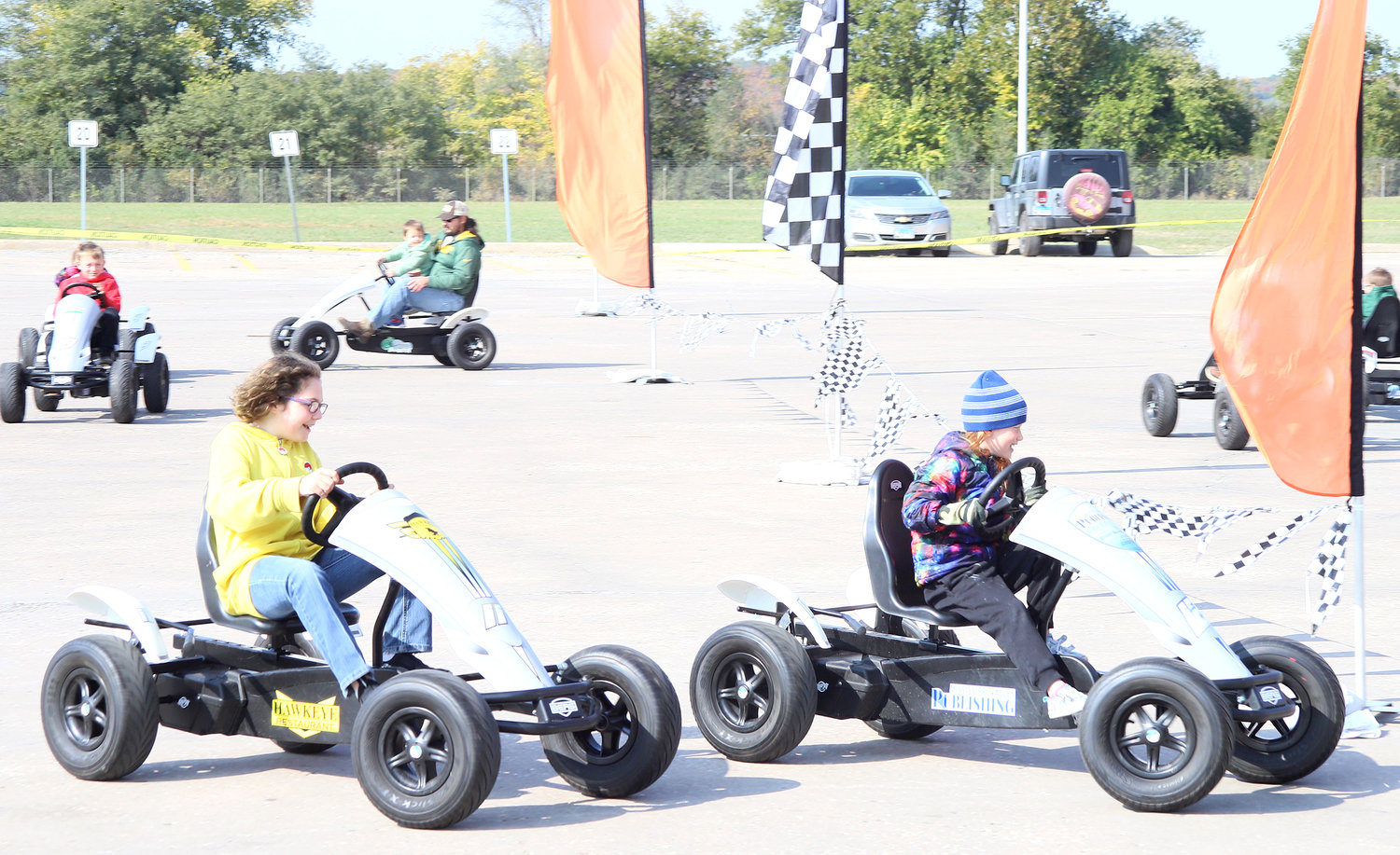 As part of Sunday's 50th anniversary at Conagra in Fort Madison, family member were able to race around in pedal-powered four-wheelers before touring the food-processing/packaging facility.