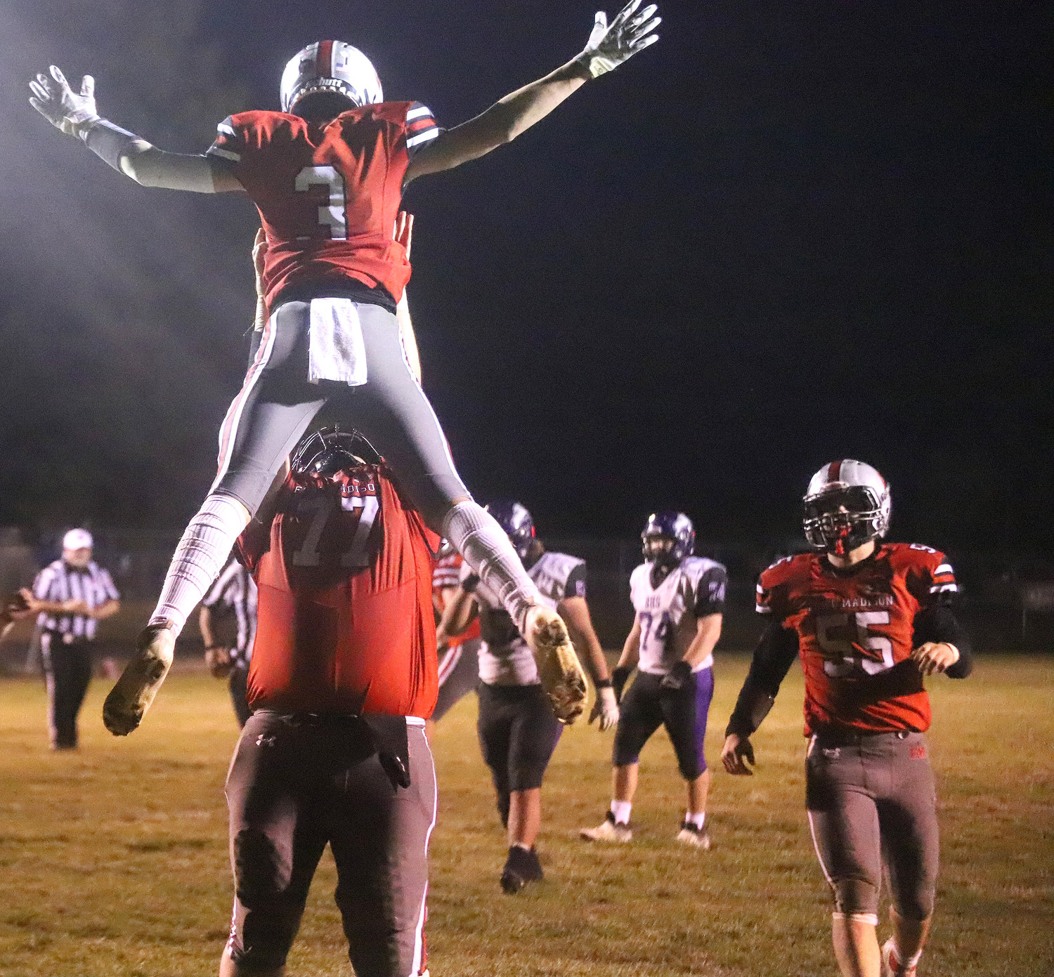 Fort Madison's Henry Wiseman gets thrown into the air by senior Matteo Lozano after Wiseman hauled in a 22-yard touchdown pass with :33 seconds left to give Fort Madison the win.