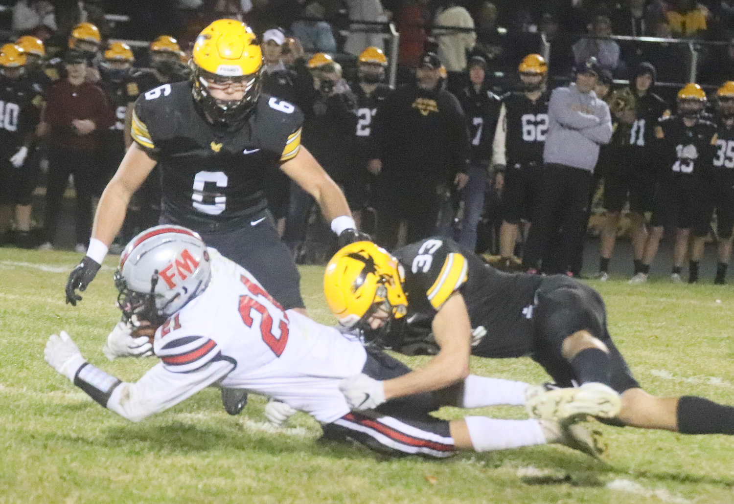 The Hounds' Kane Williams stretches for extra yards after a 16-yard reception in the third quarter Friday night in Waverly.