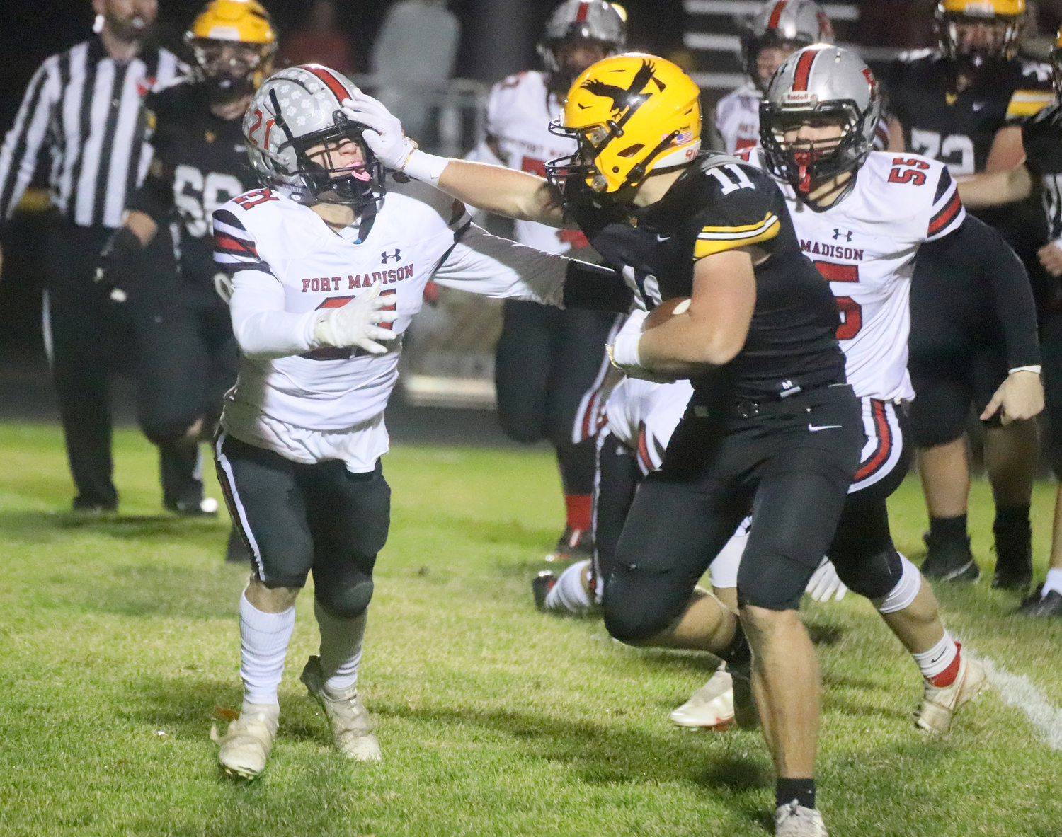 The Go-Hawks' Tyler Gayer stiff arms Fort Madison's Kane Williams on a run early in the first quarter Friday night in Waverly.