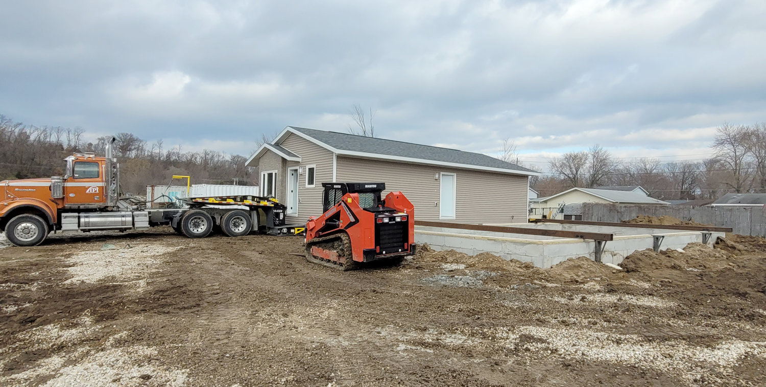 A Homes for Iowa offender-built home sits on a trailer before going onto a foundation on Green Oak Drive last week.