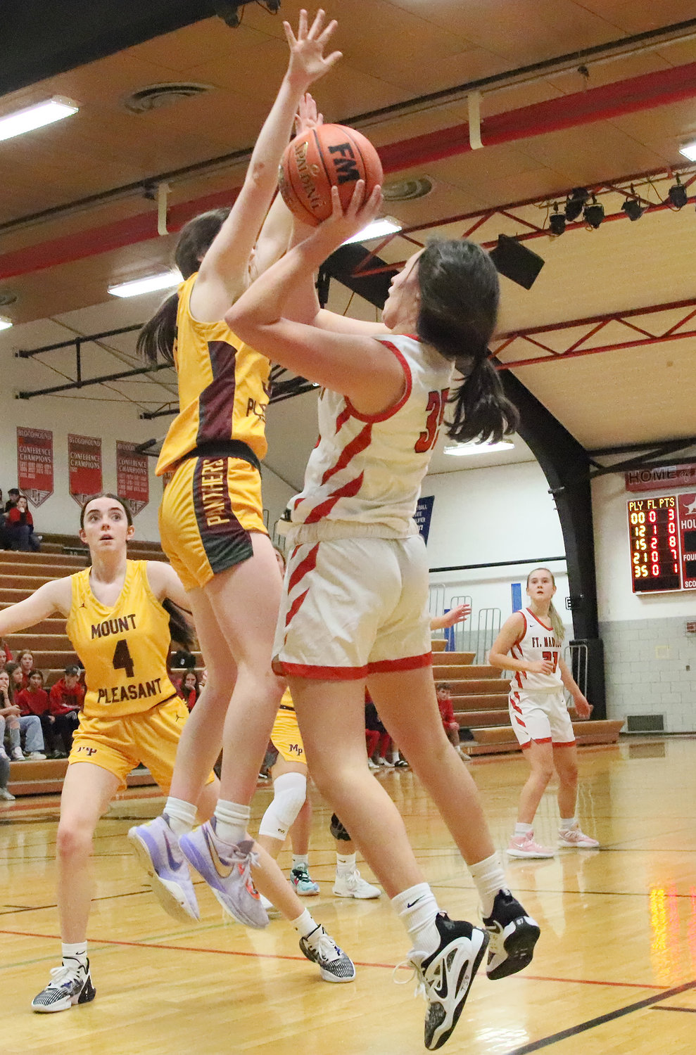 Fort Madison's Halle Menke goes up for a shot in the first half of the Hounds' 41-36 win over Mt. Pleasant Friday night.