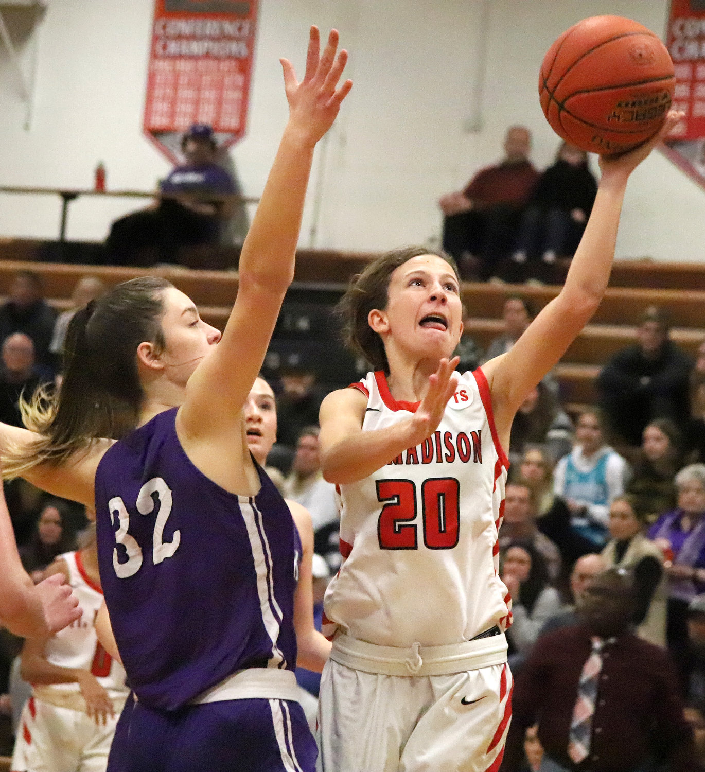 Freshman Hadley Wolfe lays up a shot against Keokuk's Camryn Atterberg in the first period Friday night.