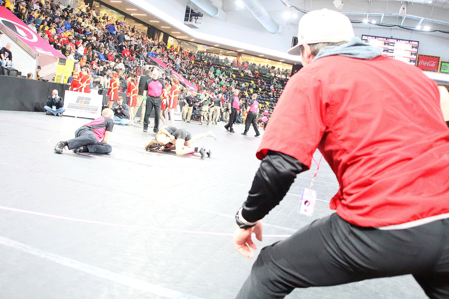 Fort Madison head coach Kyle Doherty reacts to a momentum shift in Hailey Kemper's first match of the day Thursday at the Xtreme Arena in Coralville.