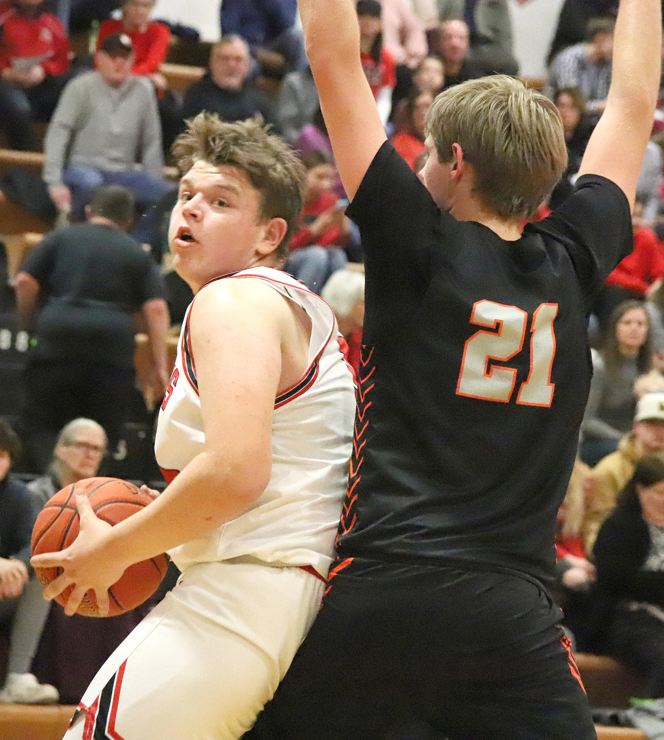 Junior Hunter Cresswell makes a move inside on Washington's Avery Six (21) Friday night in first half action in Fort Madison. Cresswell finished with a career-high 35 points in the loss.