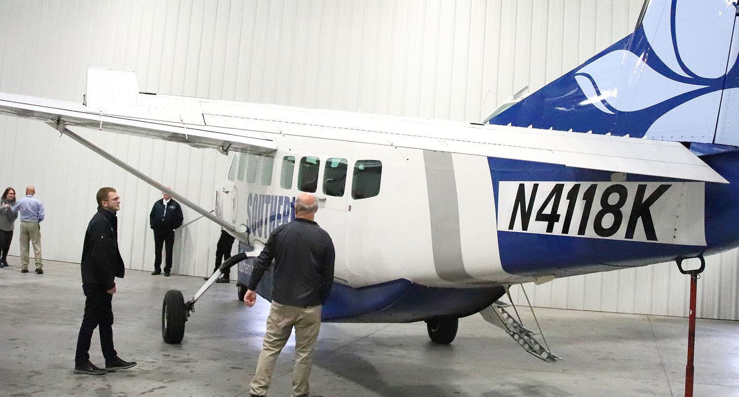 Visitors look over the Southern Airways aircraft Tuesday morning at Southeastern Iowa Regional Airport. Southern will take over Essential Air Service flights beginning April 1.