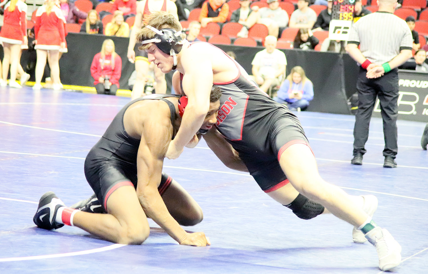 Fort Madison's Ike Thacher tries to move Fort Dodge's Dreshaun Ross in Class 3A 195 lb. quarterfinal action Thursday night. Thacher would fall by decision 11-4.