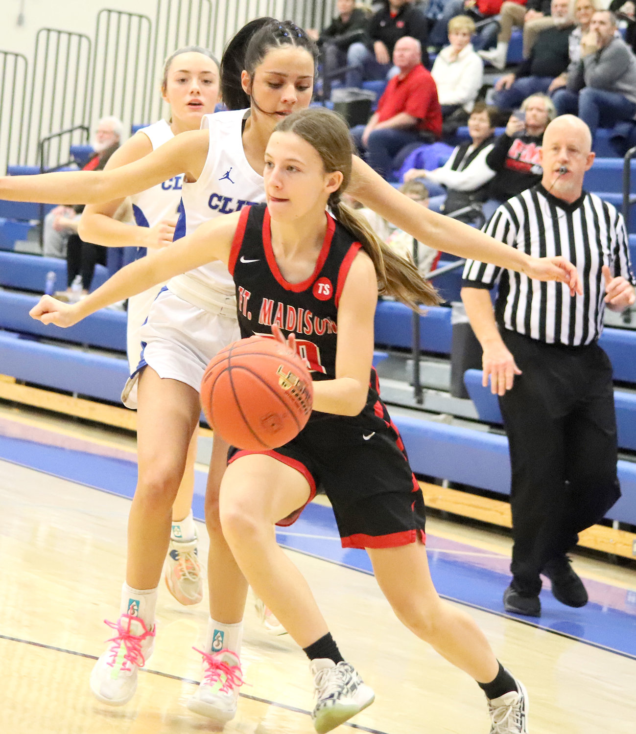 Freshman Hadley Wolfe drives past the Clippers defense in the first period. The Hounds ended their season with a 62-28 loss to Clear-Creek Amana.