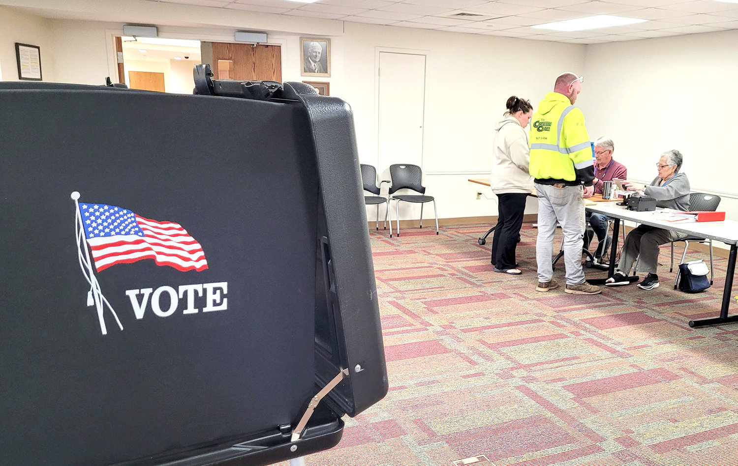 Voters register at the Fort Madison Public Library at around 5:15 p.m. to vote on the Lee County Essential Services levy Tuesday in Fort Madison.