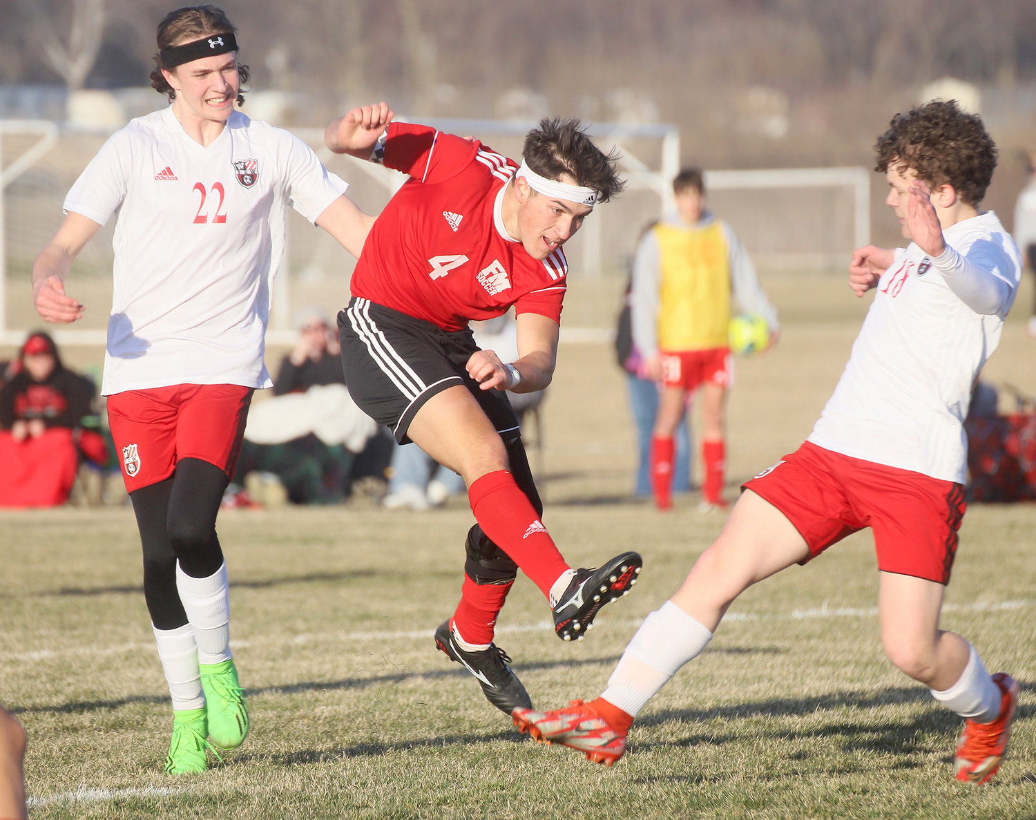 Jacob Pothitakis fires a shot between a couple Williamsburg Raiders Tuesday evening in Fort Madison.