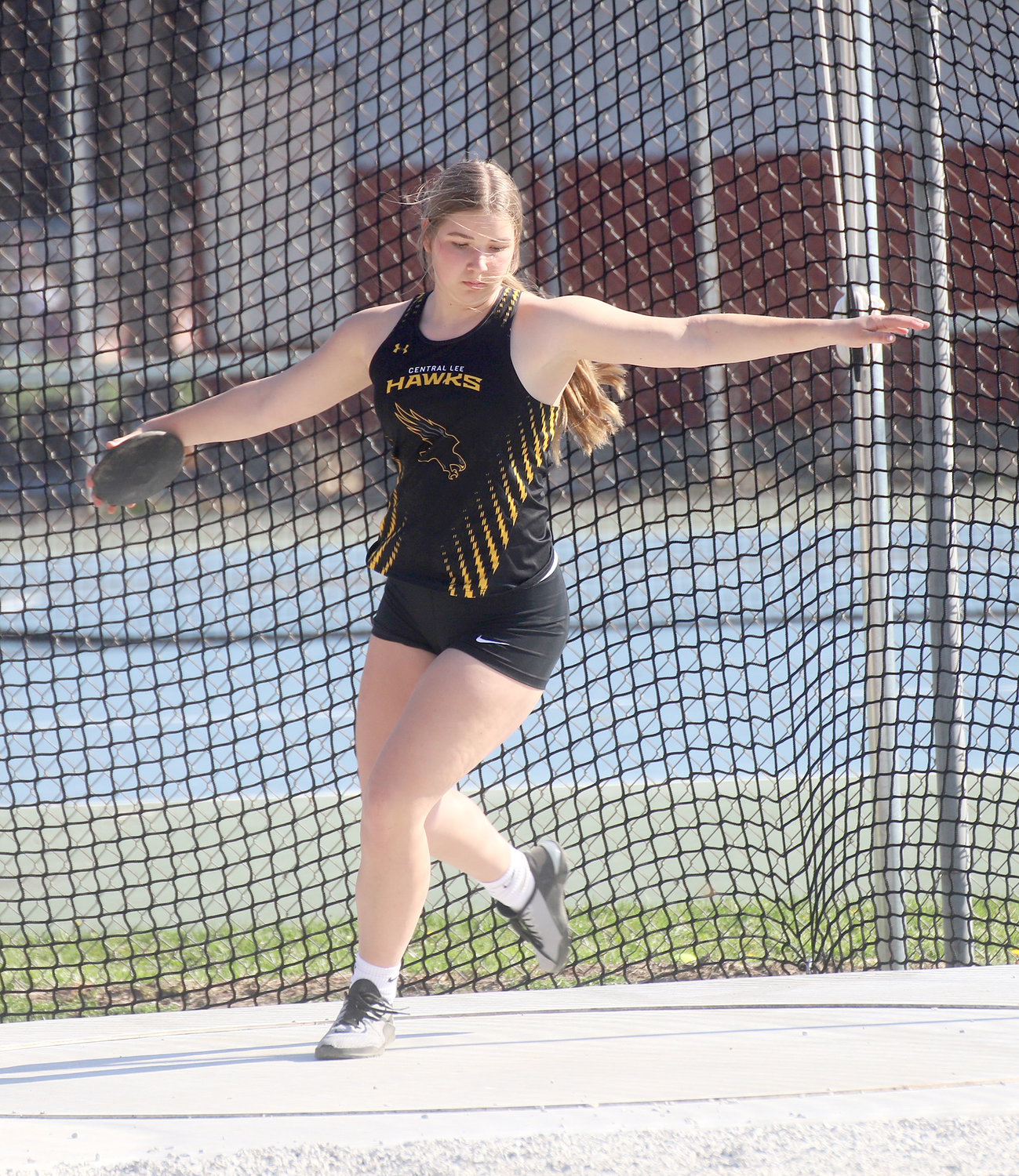 The Lady Hawks' Aubrey Weber winds up in the discus at Fort Madison High School Tuesday at the Timm Lamb Pen City Relays.