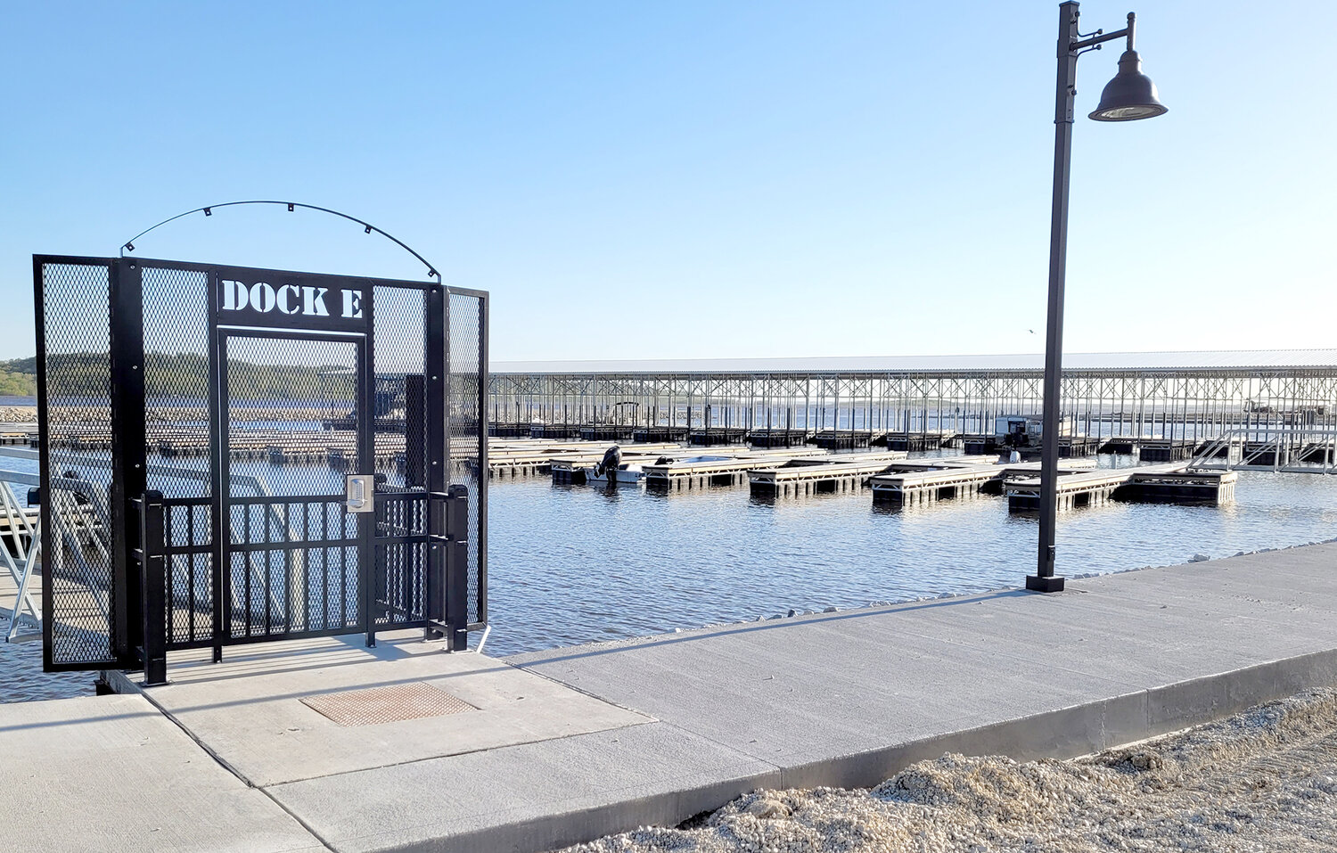 The gate to Dock E shows the modern style of the city's new Marina project. Several docks have been completed and more are underway down on the Fort Madison river front.