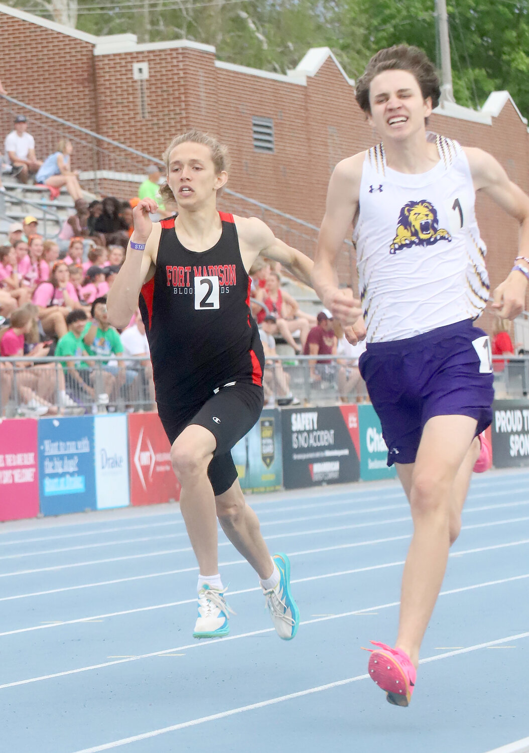 Senior Cade Packard tries to catch up with Denison Schlesweg's Ethan Perrien in the open 400 Thursday evening at Drake Stadium. Packard would finish 21st with a 52.19 a personal best.