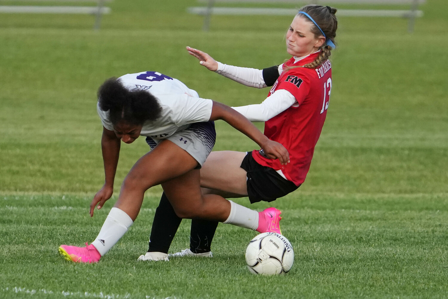 Fort Madison High School's Mary Kate Bendlage (13) collides with Keokuk's Jalyiah Gardner (8) during their Class 2A Region 5 quarterfinal game against Keokuk High School, Friday, May 19, 2023 at Fort Madison's Baxter Sports Complex. Fort Madison won 6-0.