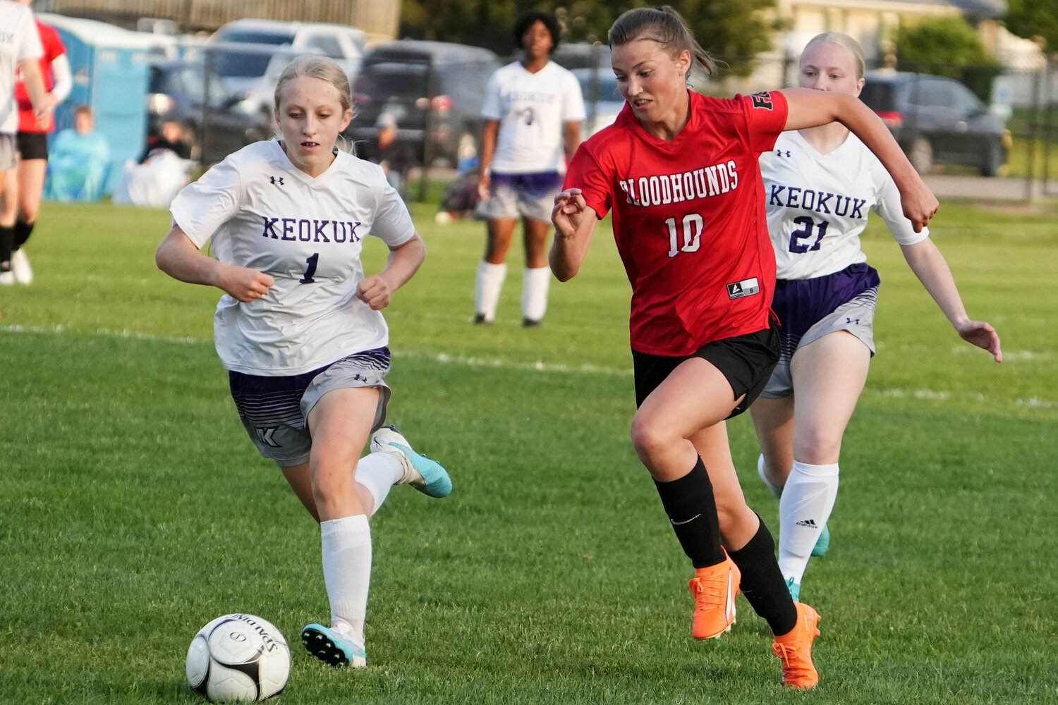 Fort Madison High School's Olivia Kraus (10) races Suzie Whitaker (1) for the ball during their Class 2A Region 5 quarterfinal game against Keokuk High School at Fort Madison's Baxter Sports Complex. Fort Madison won 6-0.
