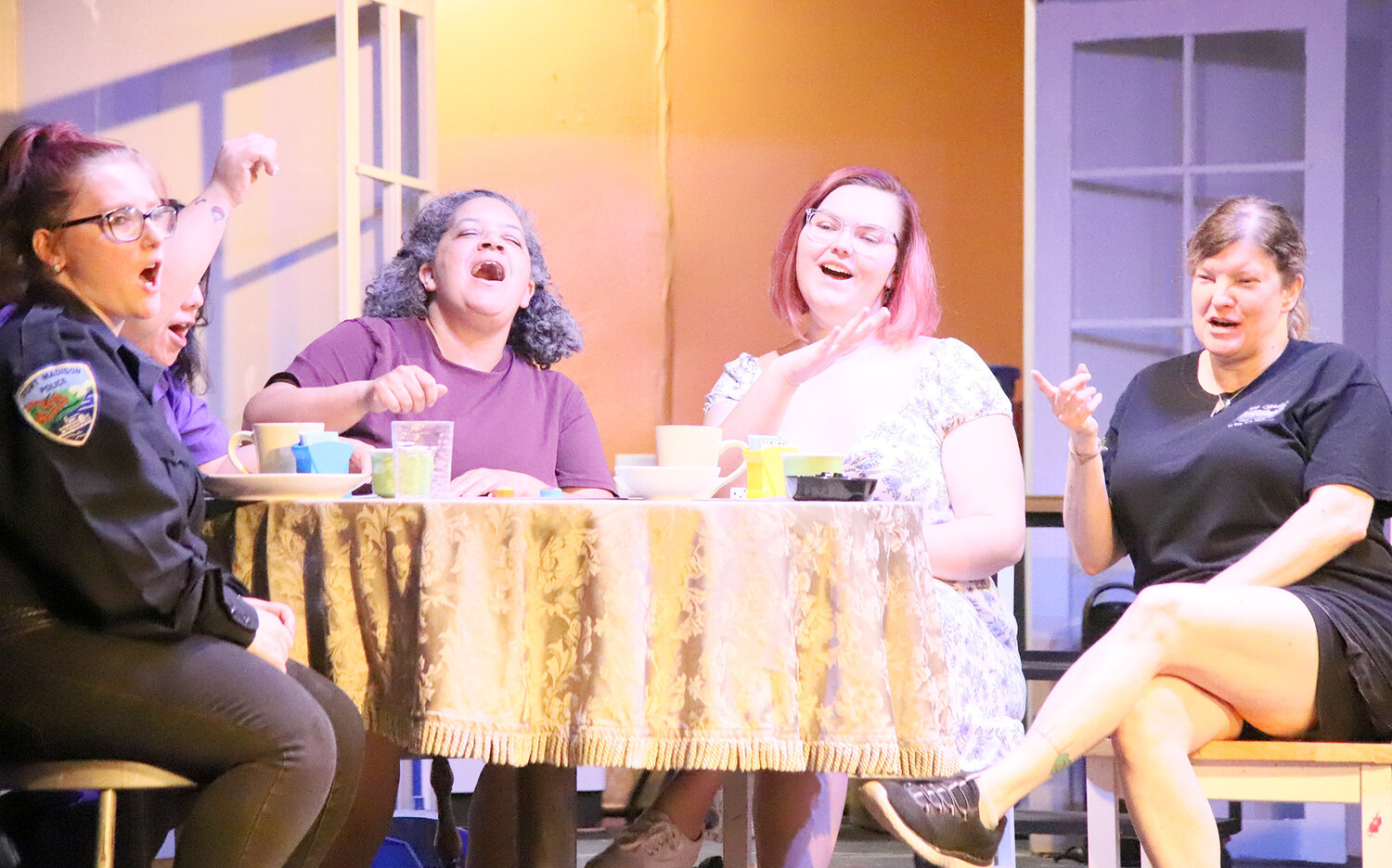 Four friends from The Odd Couple - Female version share a song during a game of trivia pursuit in the first act Tuesday during a dress rehearsal.