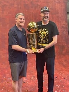 Ryan Bowen poses with NBA Championship photo with his brother Tyler following the Denver Nuggets title win Monday night. Bowen, a FM native is an assistant coach for the Nuggets.