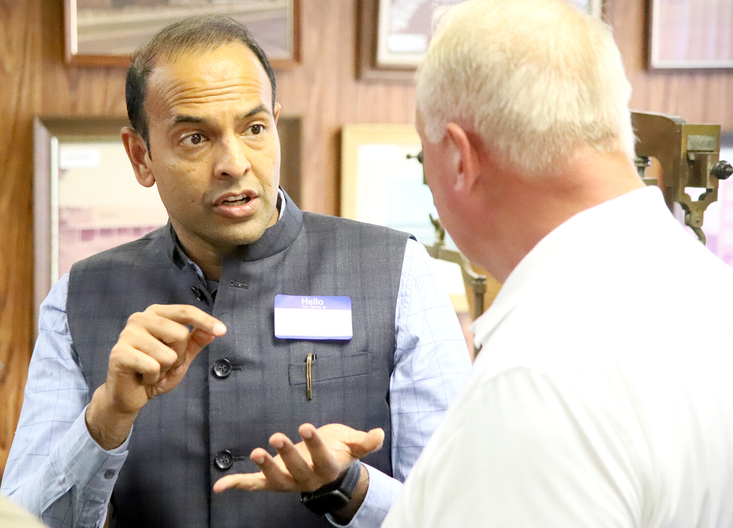 Sheaffer Pen owner Nikhil Ranjan talks with a former Sheaffer employee about his plans for the company since he purchased it in July. Ranjan and his parents were in town Thursday and Friday to learn about the city and the Sheaffer Pen legacy.