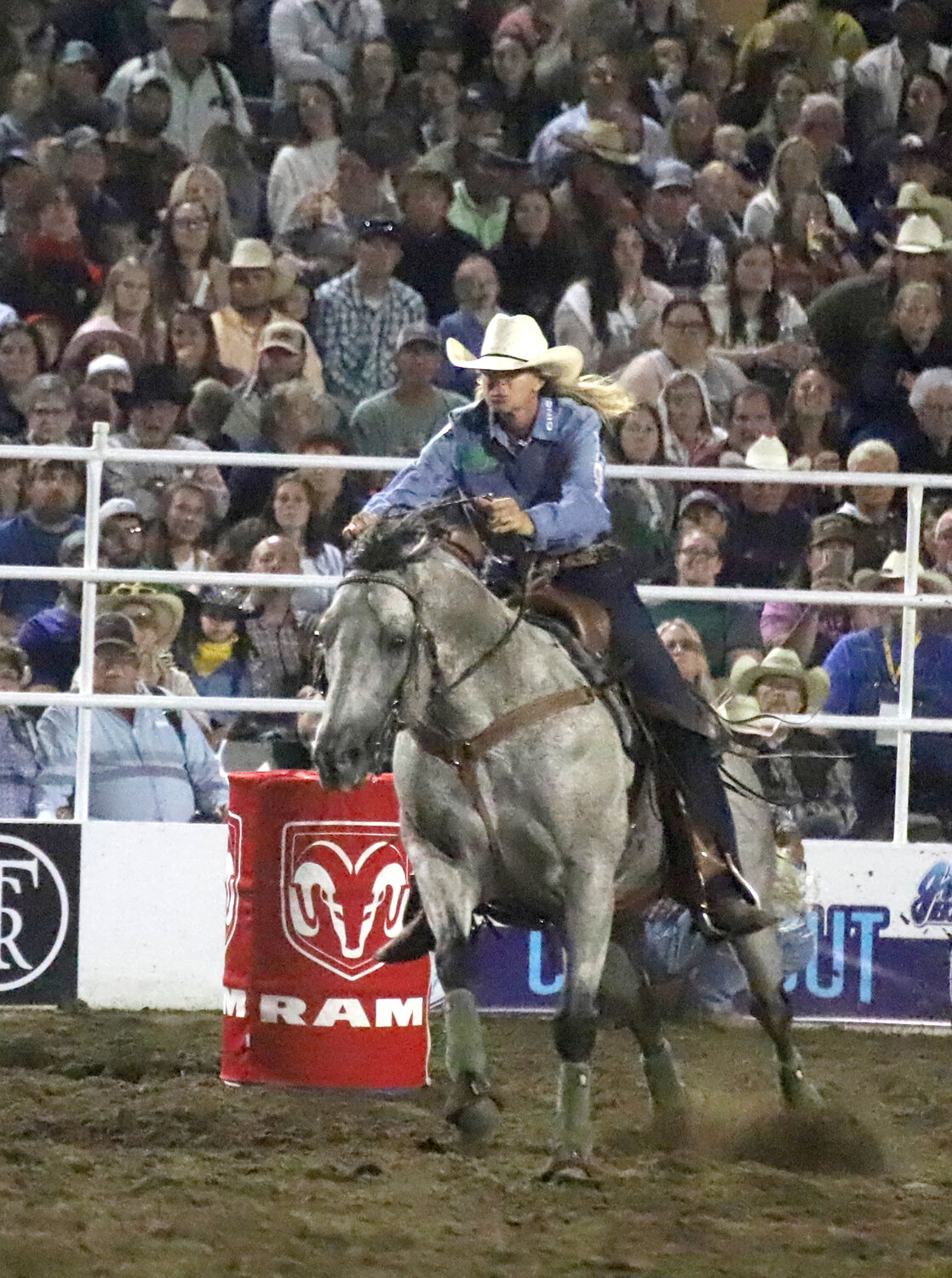 Barrel racing legend Sherry Cervi races around a barrel on her way to winning the ladies' barrel racing competition at Wednesday's Jim Baier/Dodge Ram Chute-Out kicking off the Tri-State Rodeo in Fort Madison.