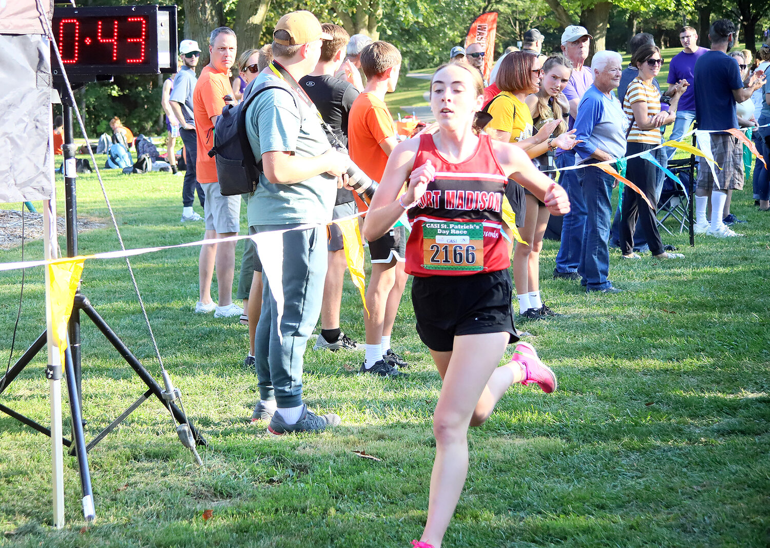 Senior Paetyn Wiegand crosses the finish line at 20:43, good enough for 3rd place in the girls' Varsity A race in Fort Madison cross-country action Thursday night.