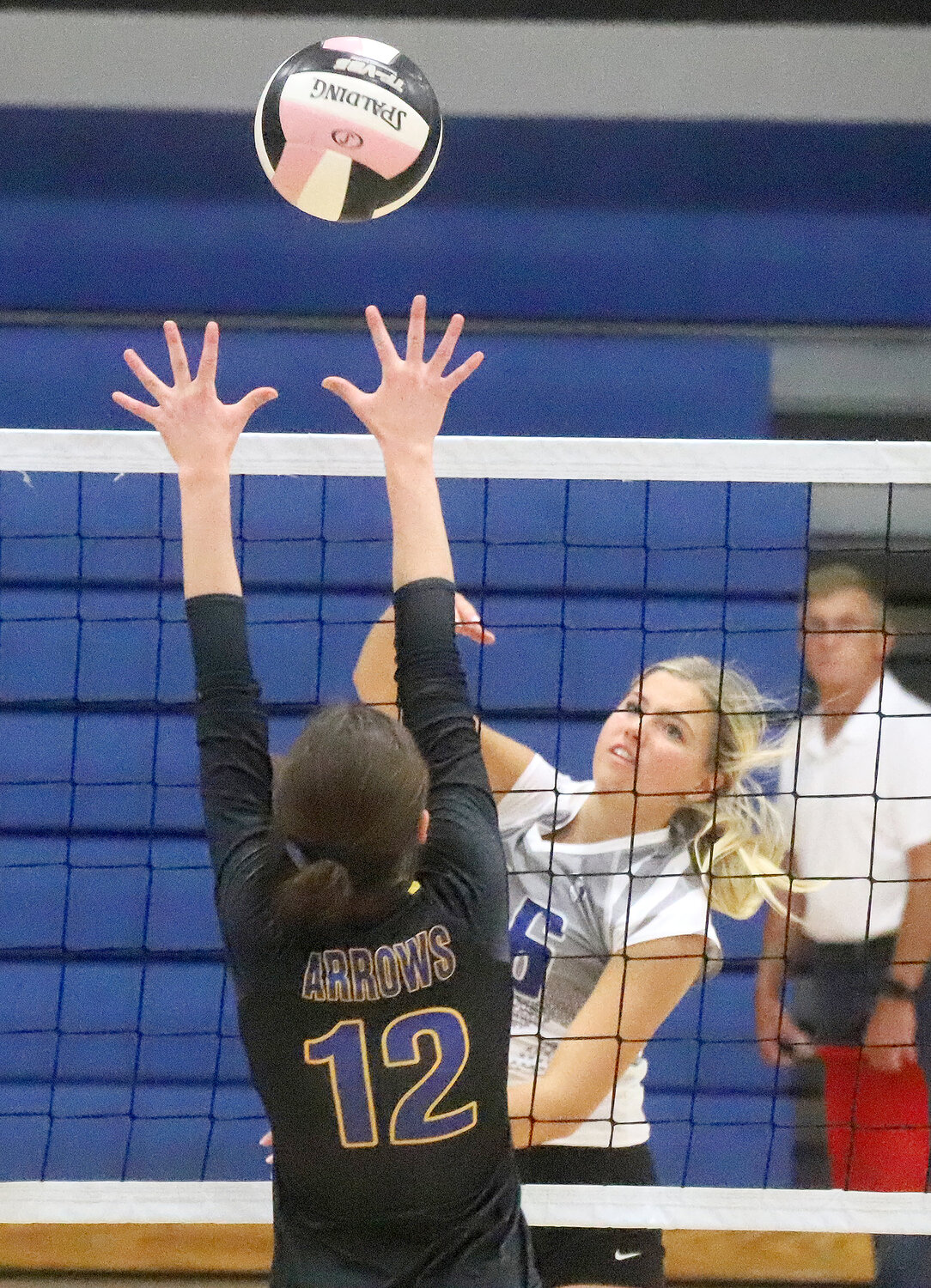 Holy Trinity Catholic's Taegan Dennings attacks over a Wapello defender Monday night in the title match of the Crusaders' HTC Classic at Shottenkirk Gym. The Crusaders won going 4-0 on the night.