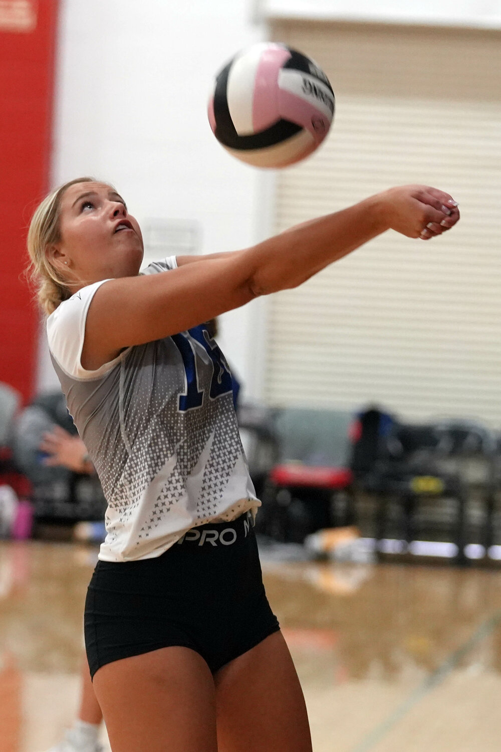 Holy Trinity Catholic High School'sTeagan Denning (16) keeps the ball in play during their Southeast Iowa Superconference game against Mediapolis High School, Saturday, September 23 at Southeastern Community College's Loren Walker Arena.