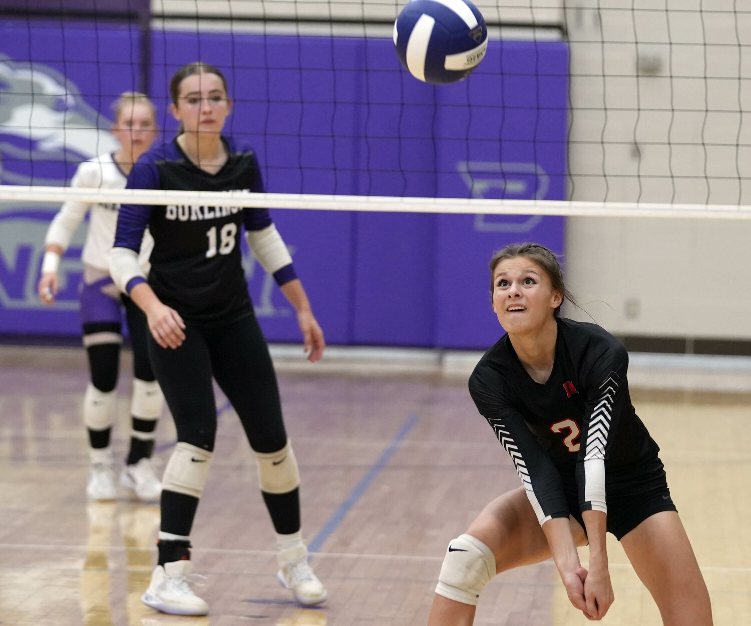 Fort Madison High School's Mara Smith (2) keeps the ball in play during the second set of their match against Burlington High School, Tuesday, September 26 at Burlington's Carl Johannsen Gymnasium.