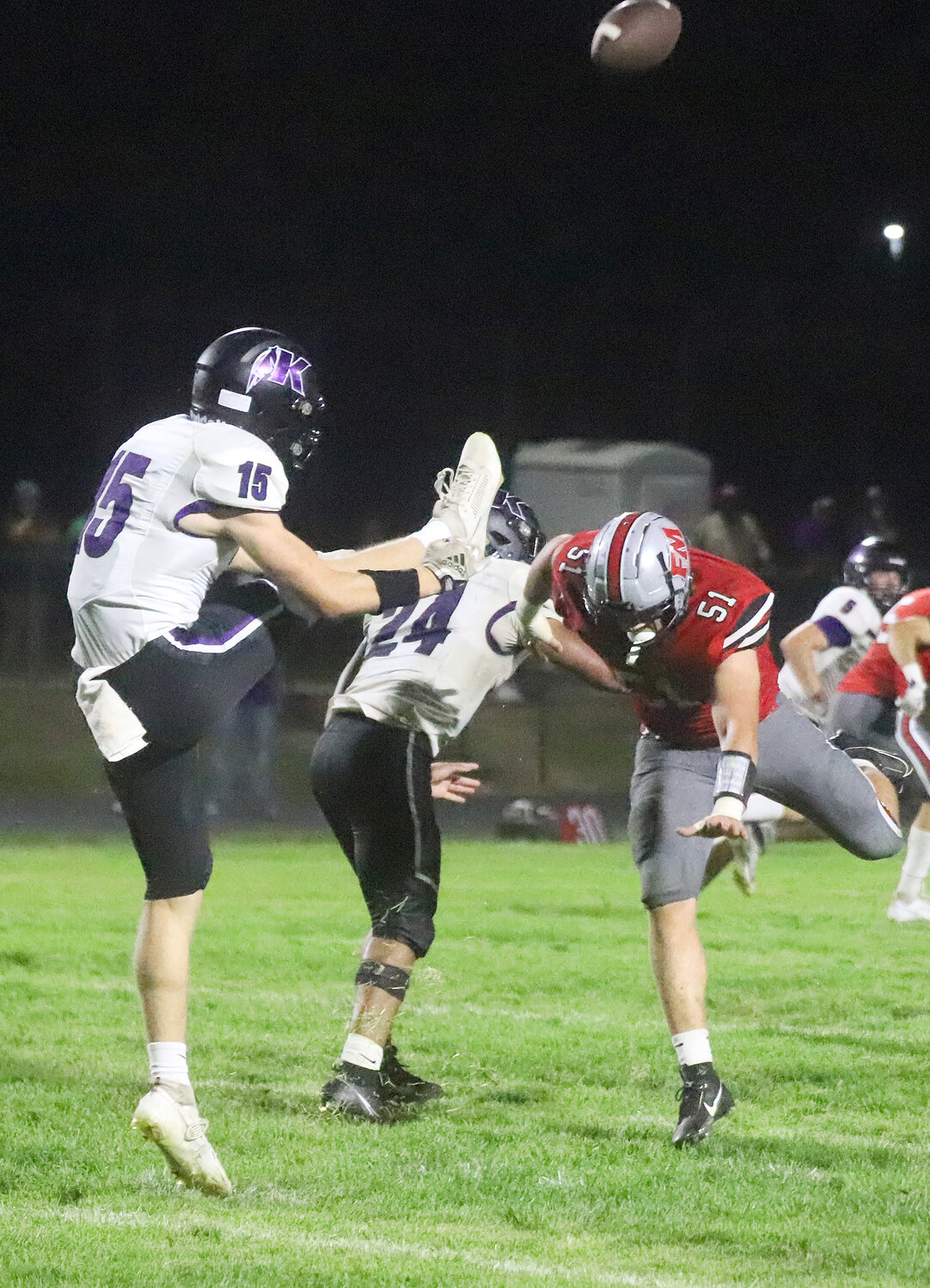 The Hounds' Justin Maitner just misses getting a hand on a punt in the fourth quarter Friday night in Fort Madison.