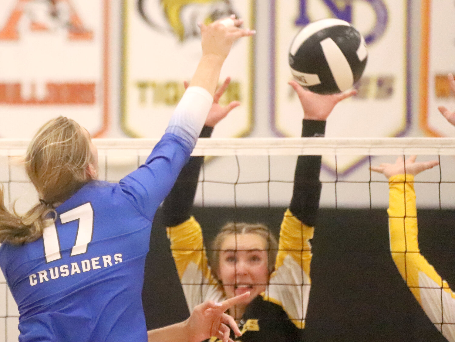 HTC's Presley Myers (17) gets a kill over the Central Lee defense in the second set of Tuesday night's Southeast Iowa Superconference matchup in Donnellson.