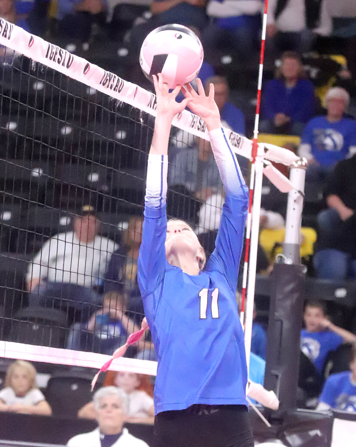 HTC's Natalie Randolph throws a dump over the net for a point in the second set Tuesday at the Xtreme Arena. Randolph missed last year with a knee injury.