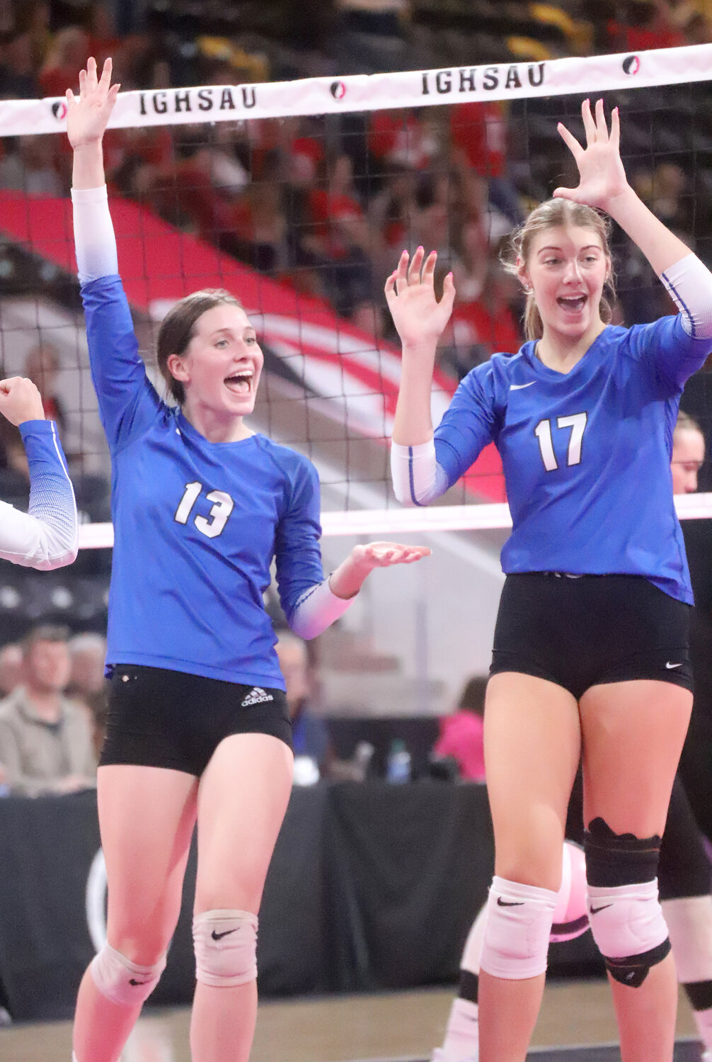 Mary Kate Bendlage and Presley Myers celebrate a point in the third set as the Crusaders narrowed in on the sweep over Don Bosco in quarterinal action of the IGHSAU State Volleyball Tournament.