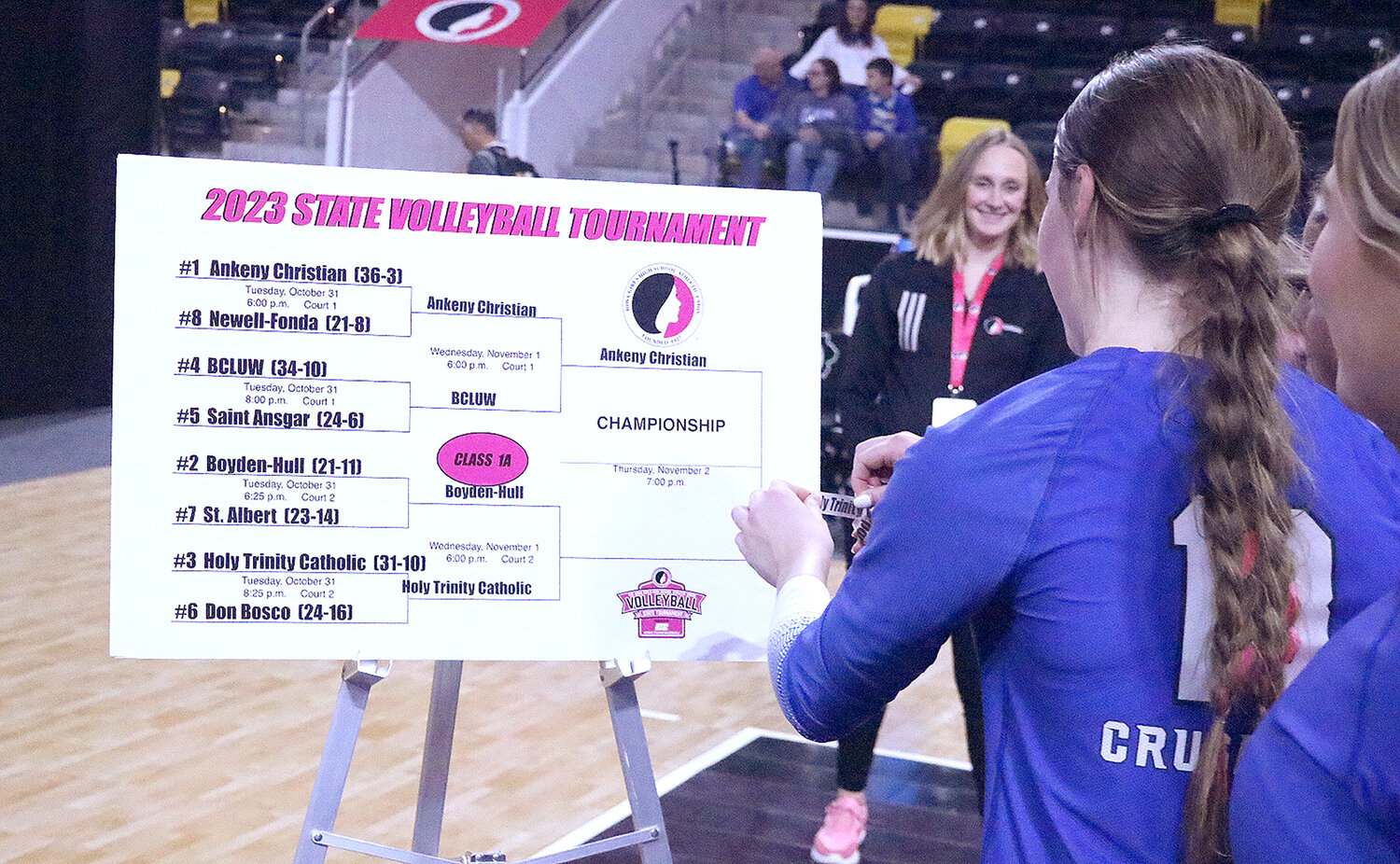 Senior Mary Kate Bendlage adds the HTC sticker to the Class 2A  title bracket after the Crusaders recorded their second sweep of the IGHSAU State Volleyball tournament Wednesday over No. 2 Boyden-Hull. HTC will face No. 1 Ankeny Christian Thursday at 7 p.m. Thursday.