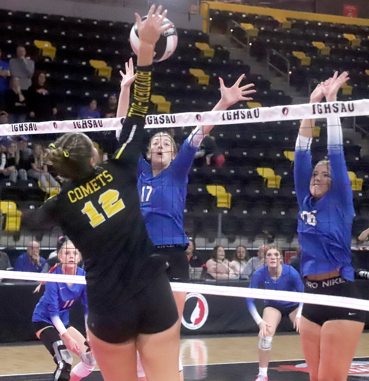 Savanna Nilles of Boyden-Hull attacks over Holy Trinity's defense in the third set Wednesday at the IGHSAU state volleyball tournament in Coralville. The Crusaders swept Boyden-Hull to advance to the state title match Thursday at 7 p.m.