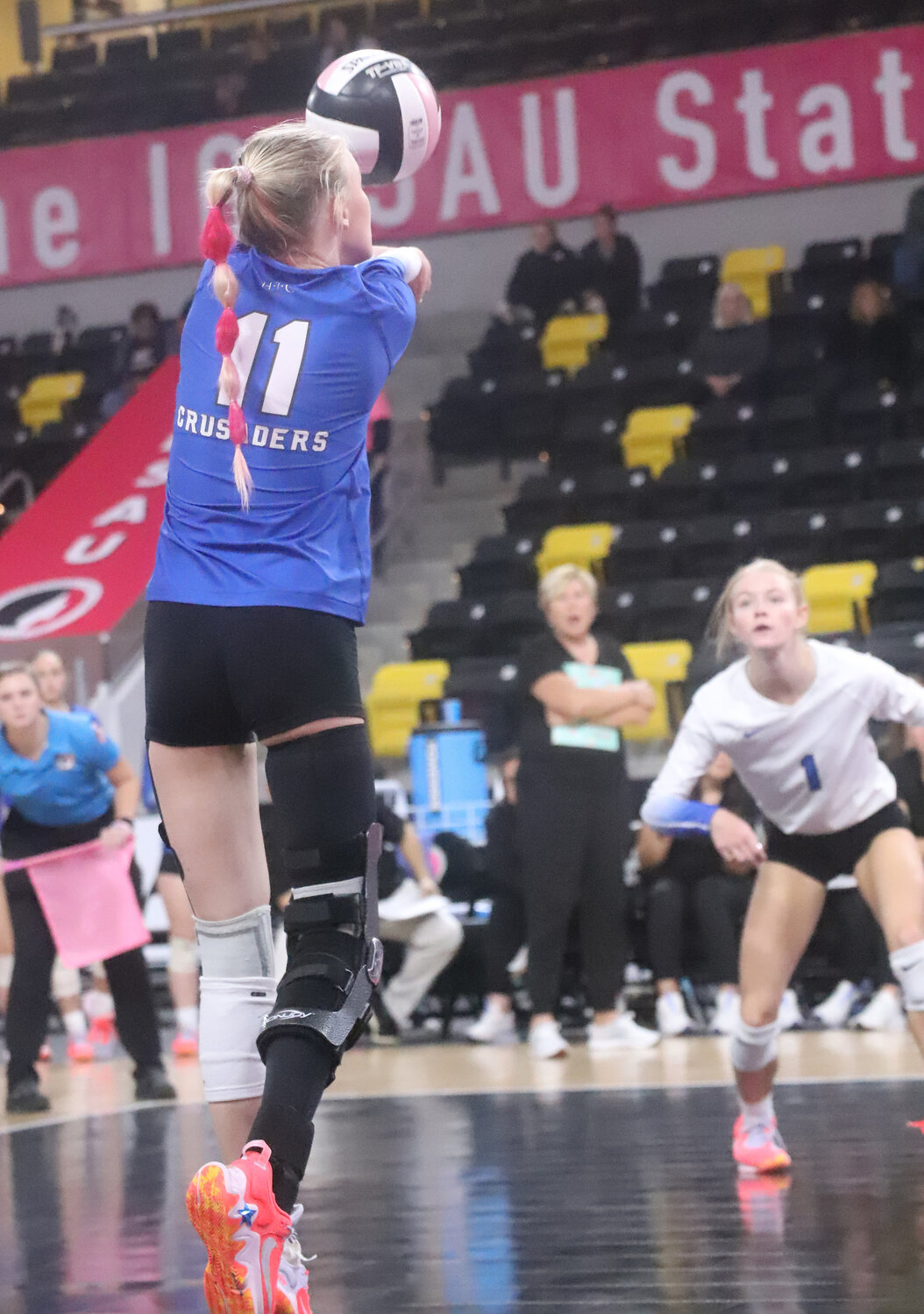 Senior Natalie Randolph goes for a kill in the first set of HTC's win over the Boyden-Hull Comets Wednesday at Xtreme Arena in Coralville. The Crusaders advance to the state title match in Class 1A Thursday night at 7 p.m.