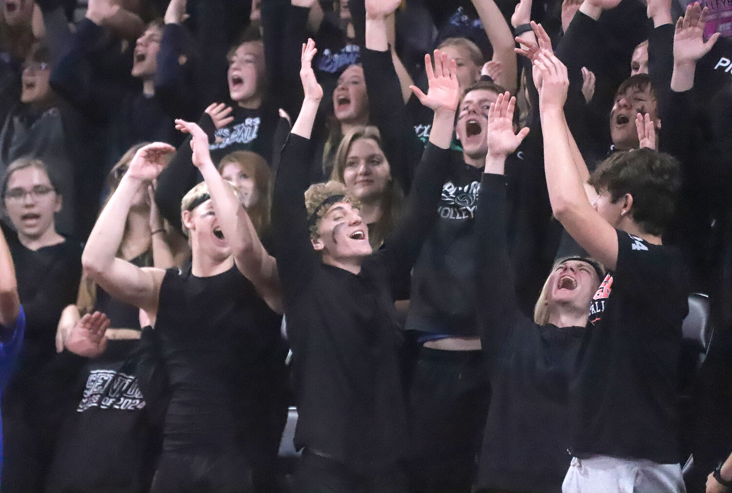 The HTC student section celebrates a point from the corner of the Xtreme Arena Wednesday as the Crusaders rolled to a 3-set win over the Boyden-Hull Comets and advanced to the Class 1A state championship match with Ankeny Christian Thursday at 7 p.m.