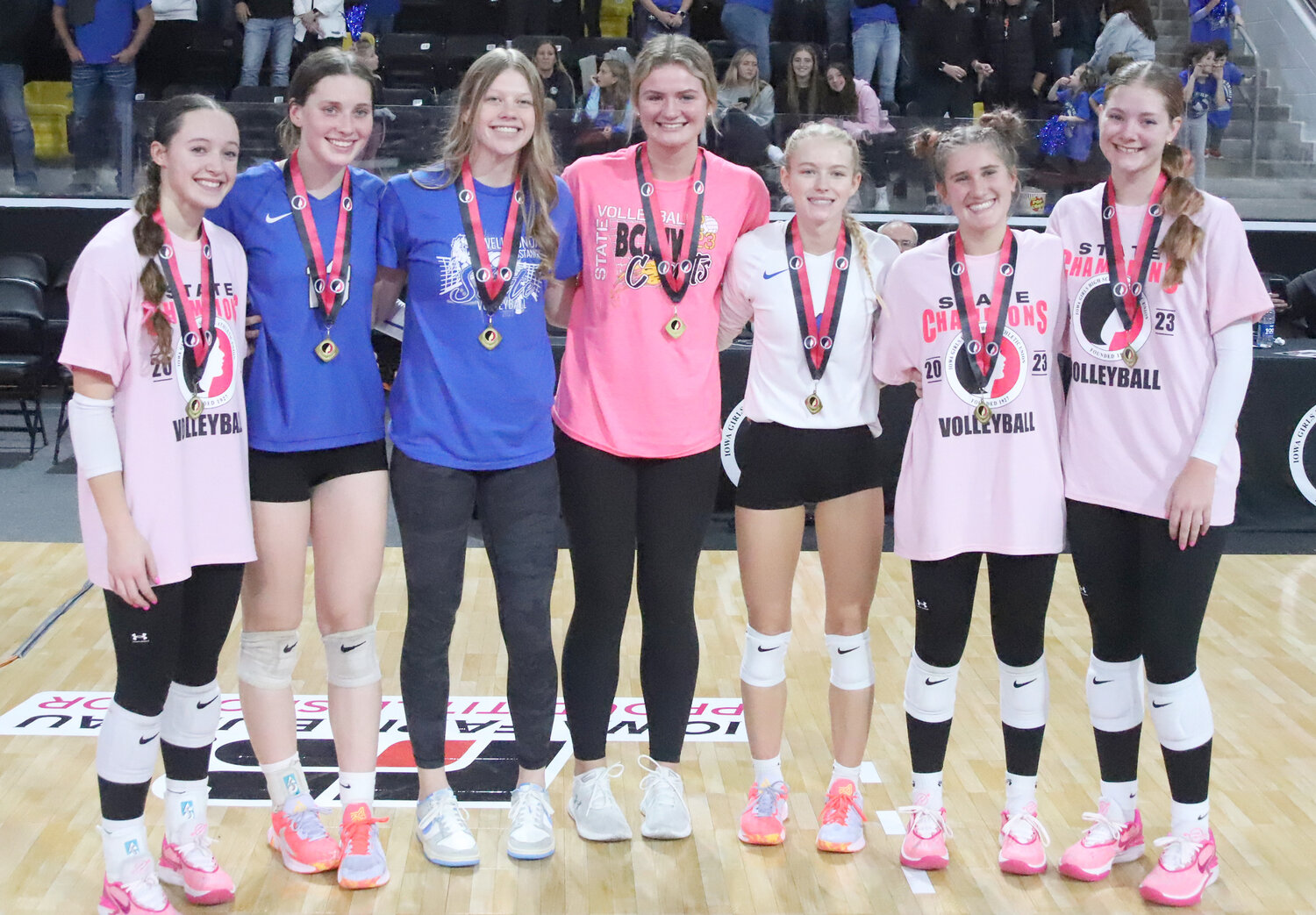 Holy Trinity's Mary Kate Bendlage second from left and Teagan Snaadt third from right were named to the Class 1A All-tournament team Thursday night.