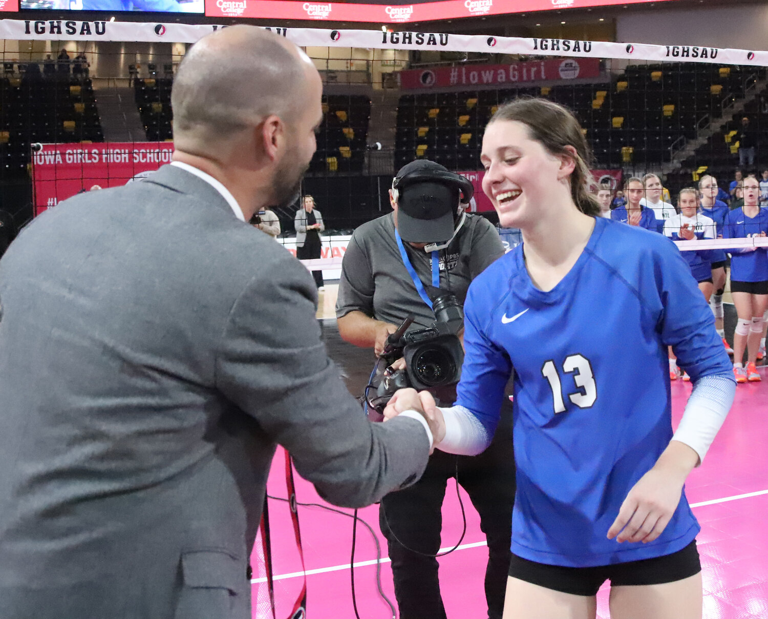 Senior Mary Kate Bendlage accepts her All-Tournament Team medal from an IGHSAU official following the Crusaders loss to Ankeny Christian Thursday in the Class 1A State Championship match 3-0.