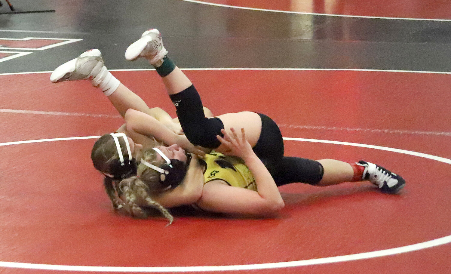 Senior Chloe Sokolik executes a cradle in her title match Monday night at the Fort Madison Invitataion enroute to her first-place finish.