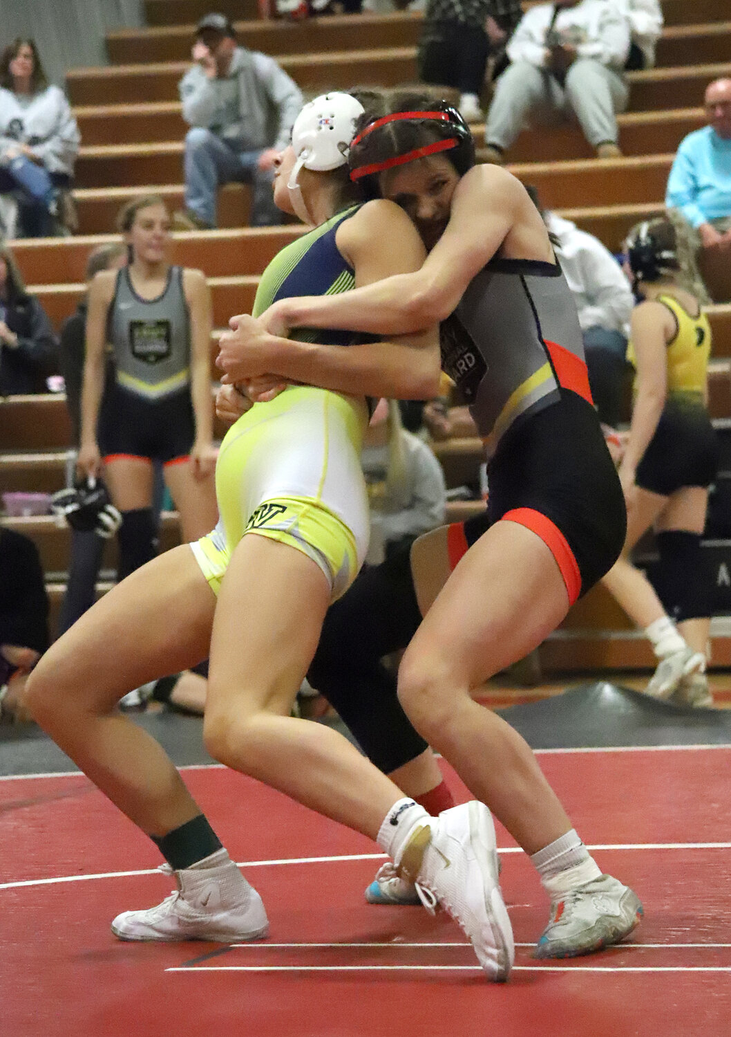 Sophomore Mara Smith tries to pull down Anna Gorsch from behind in the title match at 125 lbs. Smith would win and remains perfect on the season.