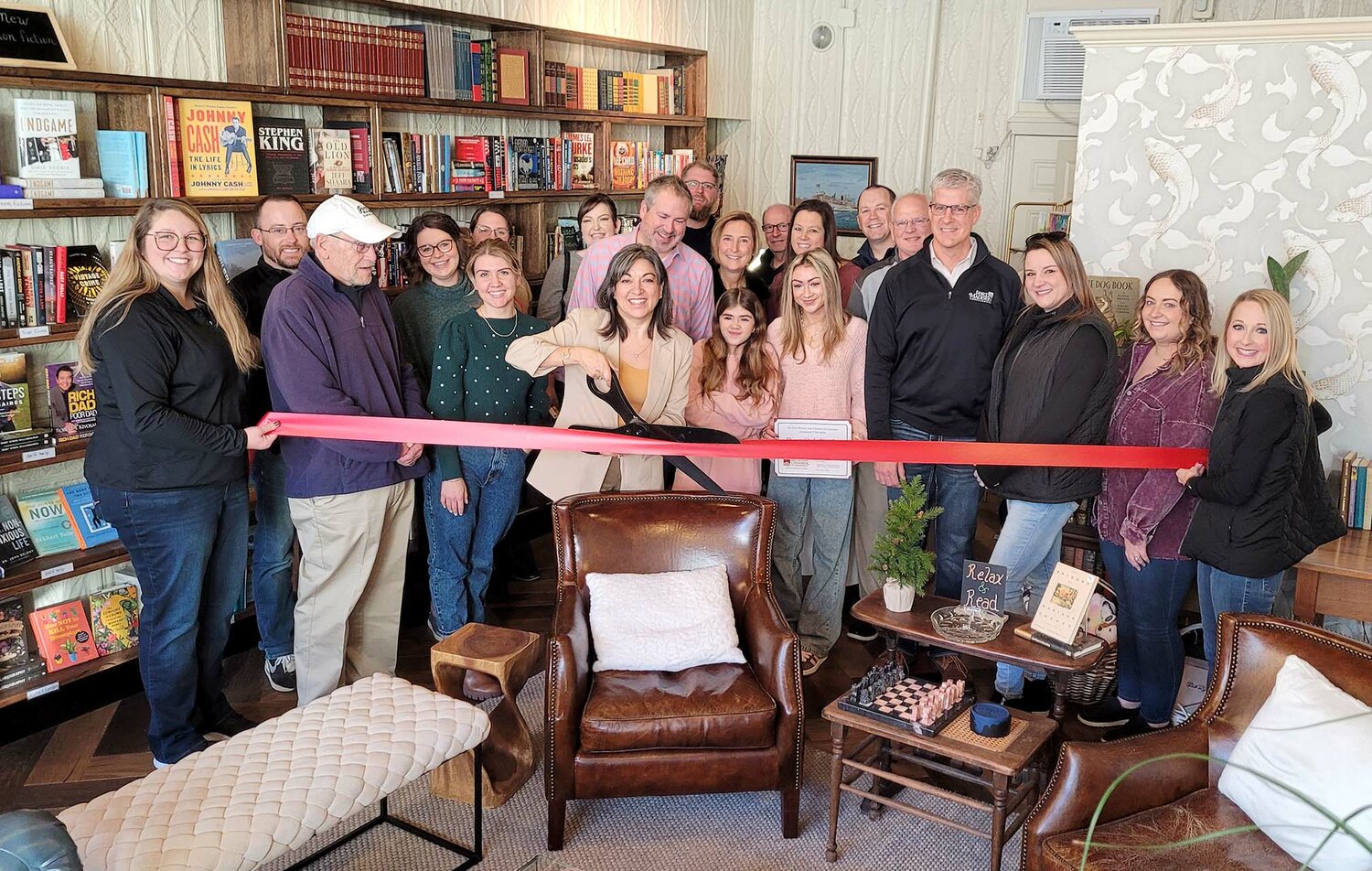 Fort Madison Chamber of Commerce Ambassadors help cut the ribbon on Dannette Baier's Bent Oak Books Friday morning in downtown Fort Madison.